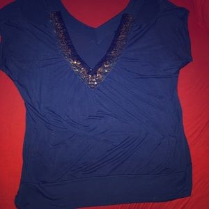 Open shoulder, sequined top